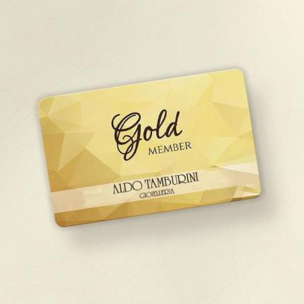 Gold Member card from Aldo Tamburini jewelry on a golden background.